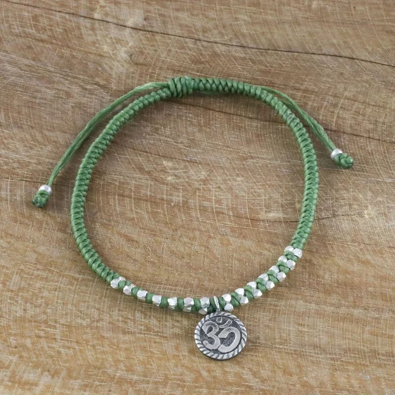 Best bangle bracelets with unique stone inlays for a one-of-a-kind accessory-Ancient Om in Green Silver Om Charm Bracelet on Braided Green Cords