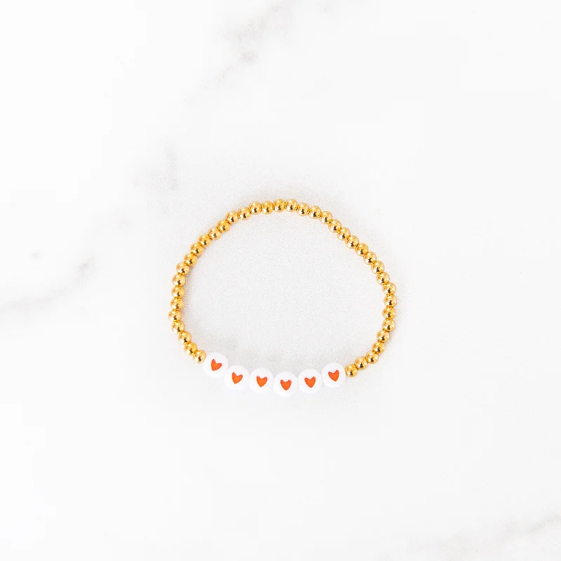 Lightweight bangle bracelets with subtle shimmer for an understated yet elegant look-Orange Heart Gold Beaded Bracelet