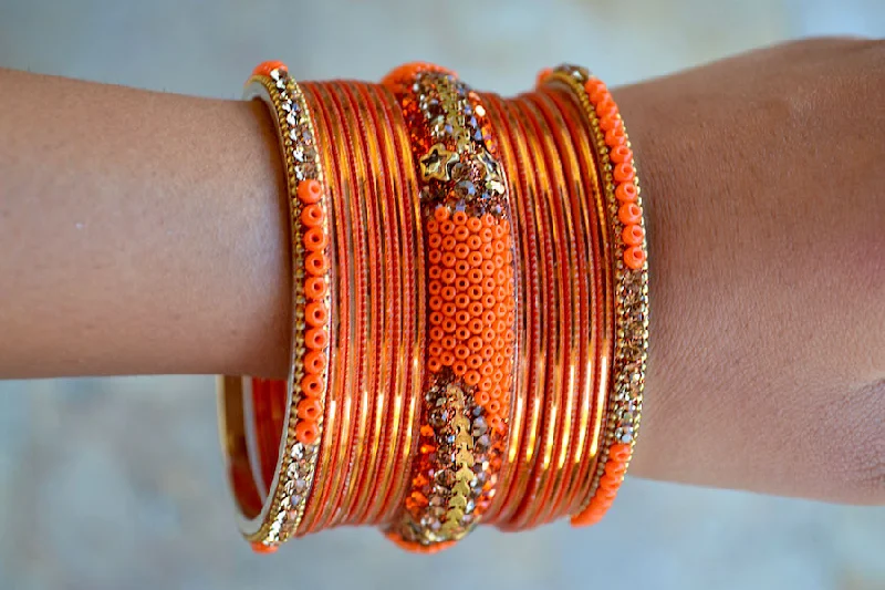 Best bangle bracelets with heart-shaped charms for a romantic and sweet touch-Orange Star Bangles