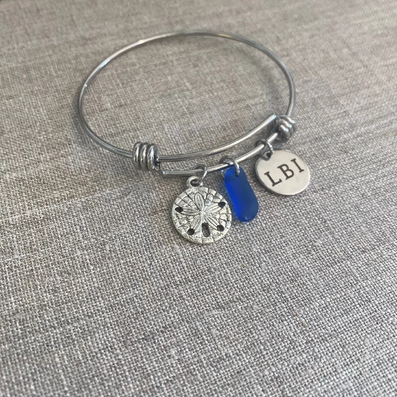 Best bangle bracelets with minimalist silver designs for a timeless, versatile look-Sand Dollar Beach Bangle