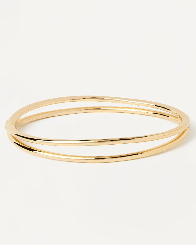 Thin bangle bracelets with mixed metals for a contemporary and versatile look-Twister Bangle